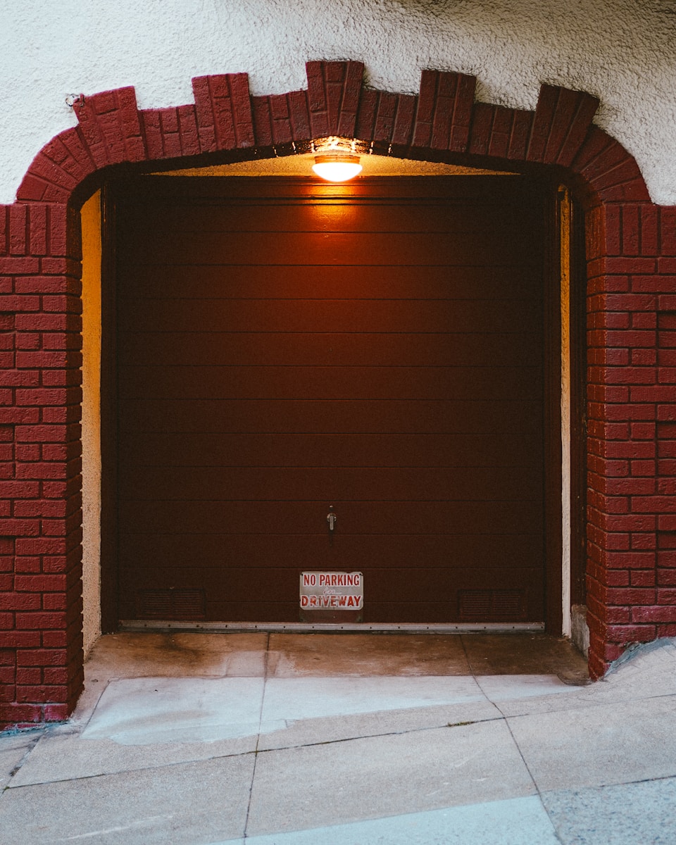 A red brick building with a red door